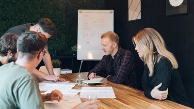 Close up of the MadeByShape team looking at wireframes